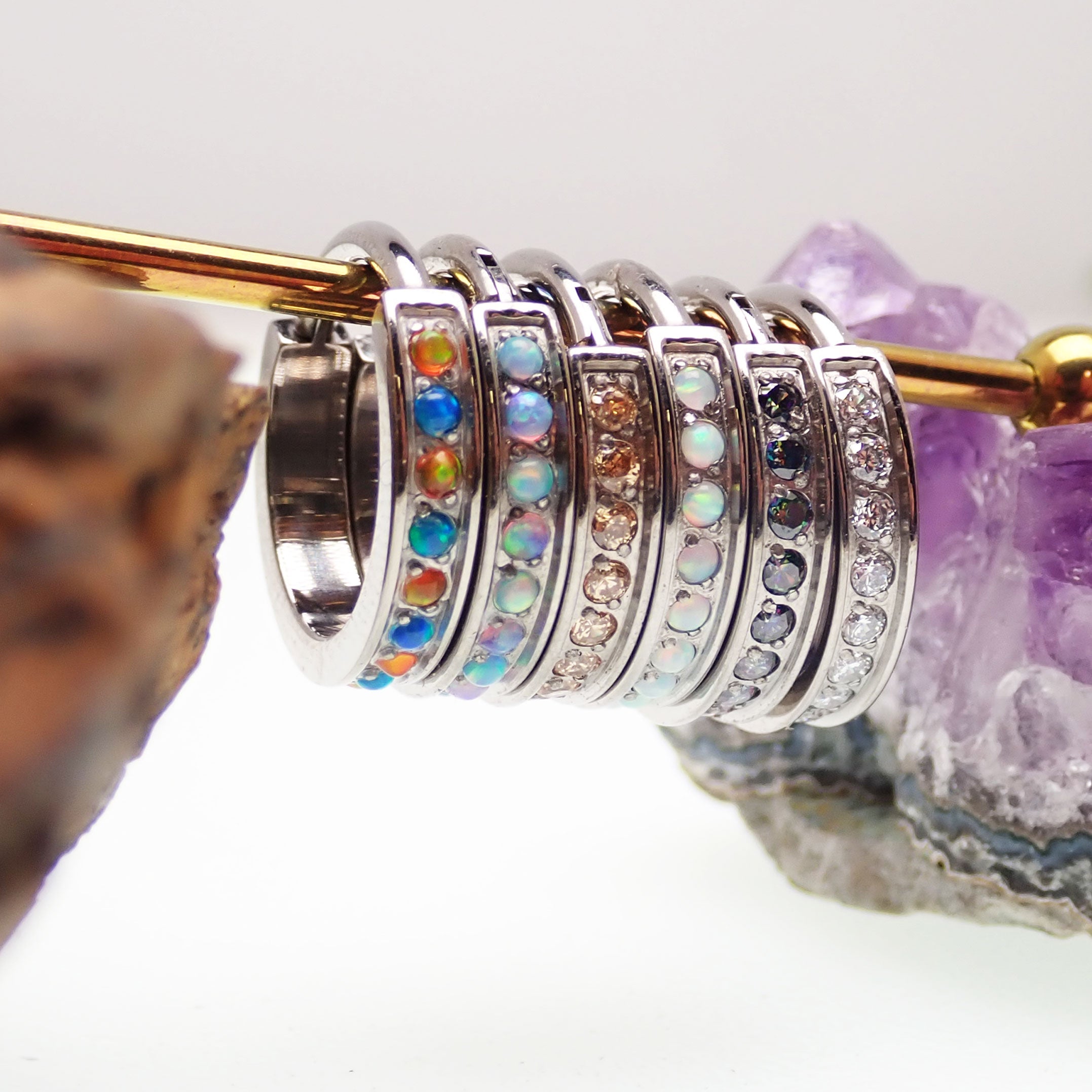 Huggie-style 10mm titanium hinged clicker with bubblegum opal design, 16g body jewelry from Body Clickers.