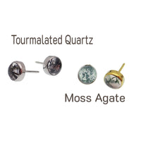 Close-up of the top part of a Moss Agate and Tourmalated Quartz titanium push fit body jewelry by Body Clickers.