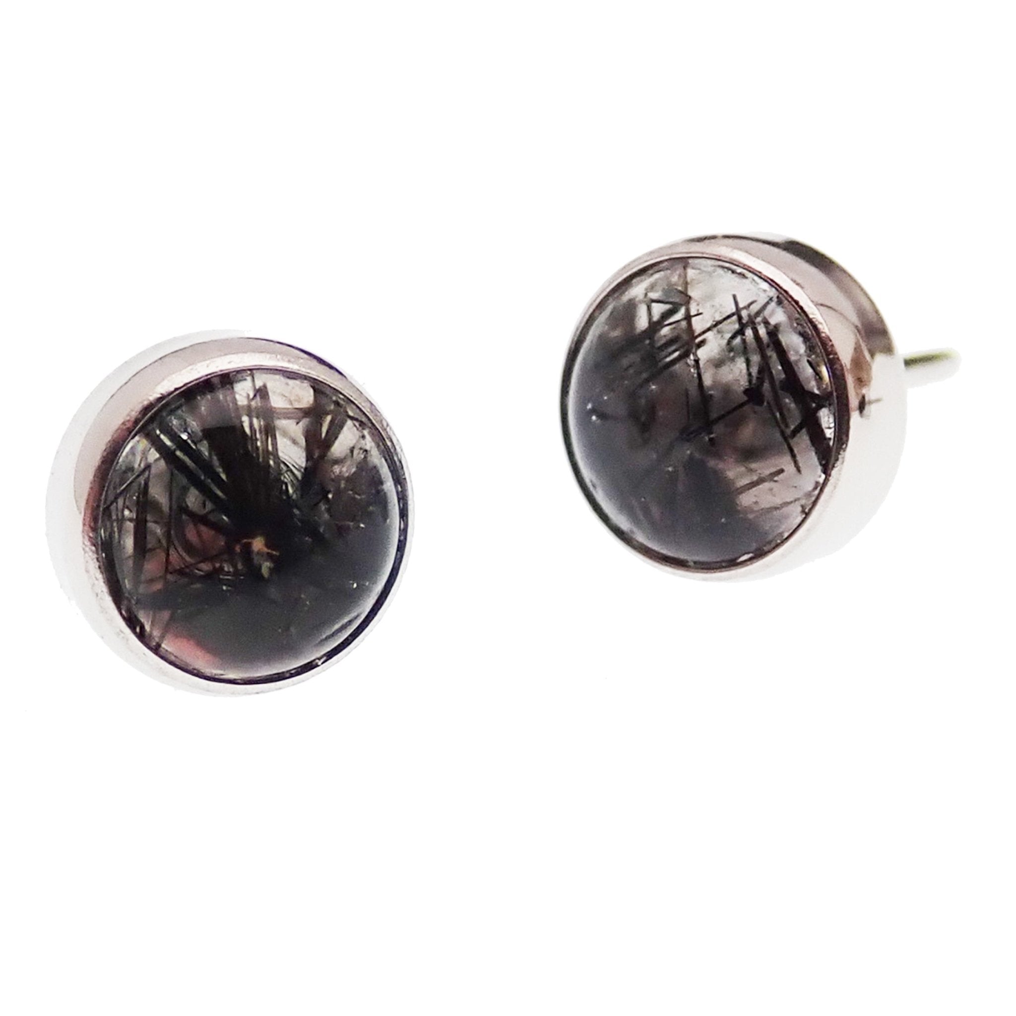 Close-up of a Moss Agate and Tourmalated Quartz titanium push fit top for body jewelry, showcasing the intricate stone pattern.