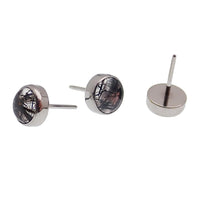 Titanium push fit top with moss agate and tourmalated quartz for body piercing, featuring natural stone designs.