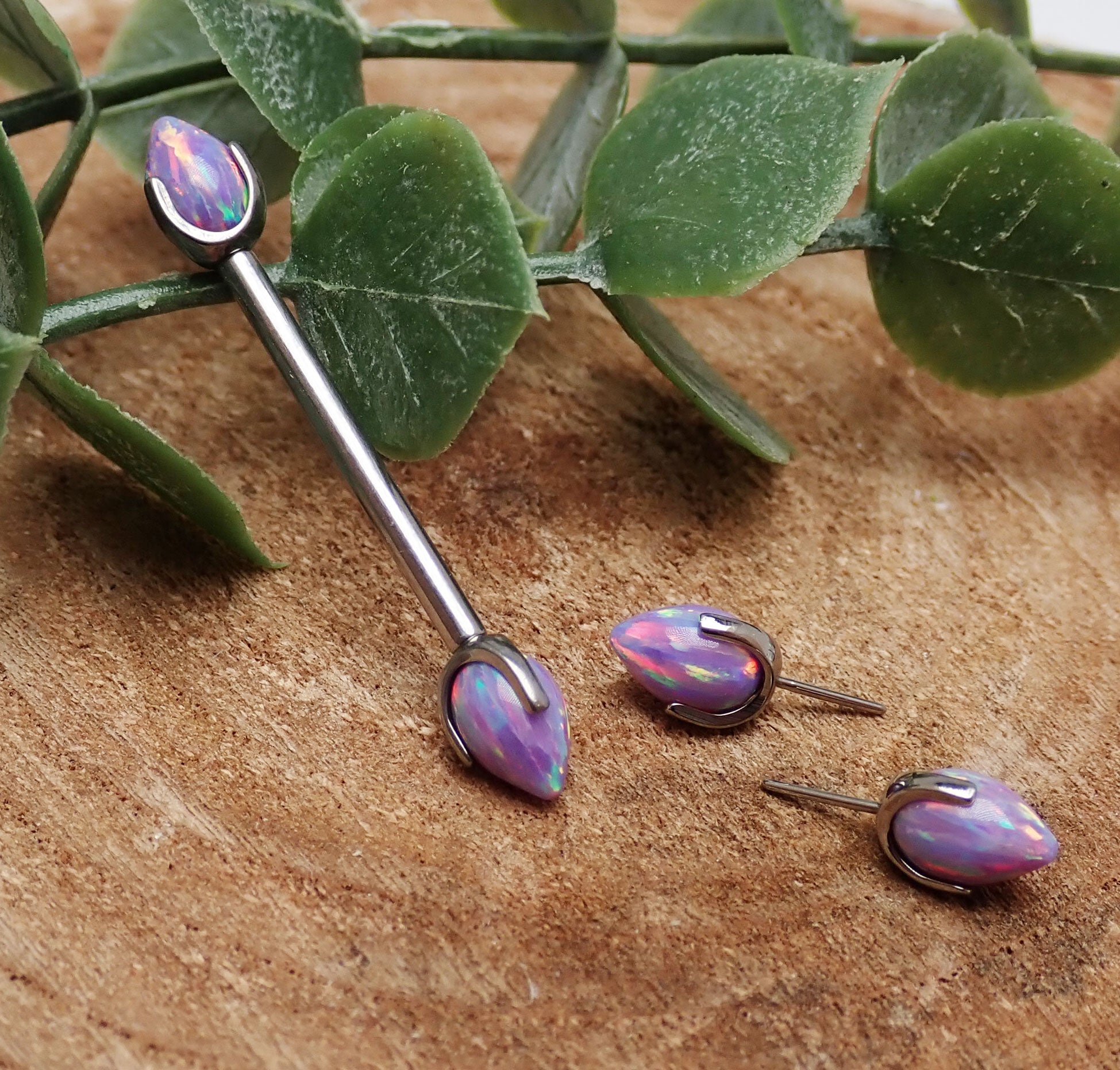 Titanium push-fit nipple piercing by Body Clickers with lavender fire opal bullet cones, 16G, 12mm size.