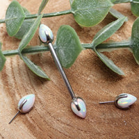 Titanium push-fit nipple piercing with white fire opal bullet cones, 16G, 12mm, from Body Clickers.