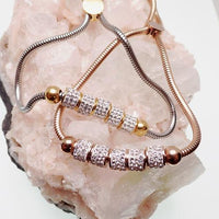 Rose gold steel multi-crystal adjustable bracelet by Body Clickers featuring multiple sparkling crystals and a sleek design