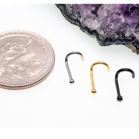Ball nose cork-style 18g body jewelry piercing by Body Clickers, featuring a titanium nose ring with a smooth ball tip.