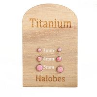 Titanium implant earrings by Halobes with royal pink opal accents, 20g body jewelry for pierced ears.