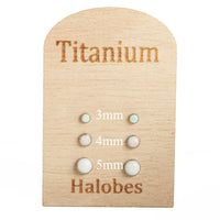 White opal implant titanium earrings in 20g body jewelry, featuring smooth, polished design by Halobes.