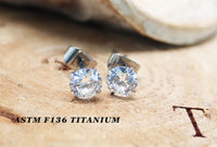 Pair of Halobes titanium implant earrings with 4mm cubic zirconia stones, 20g gauge, for pierced ears, durable and stylish jewelry
