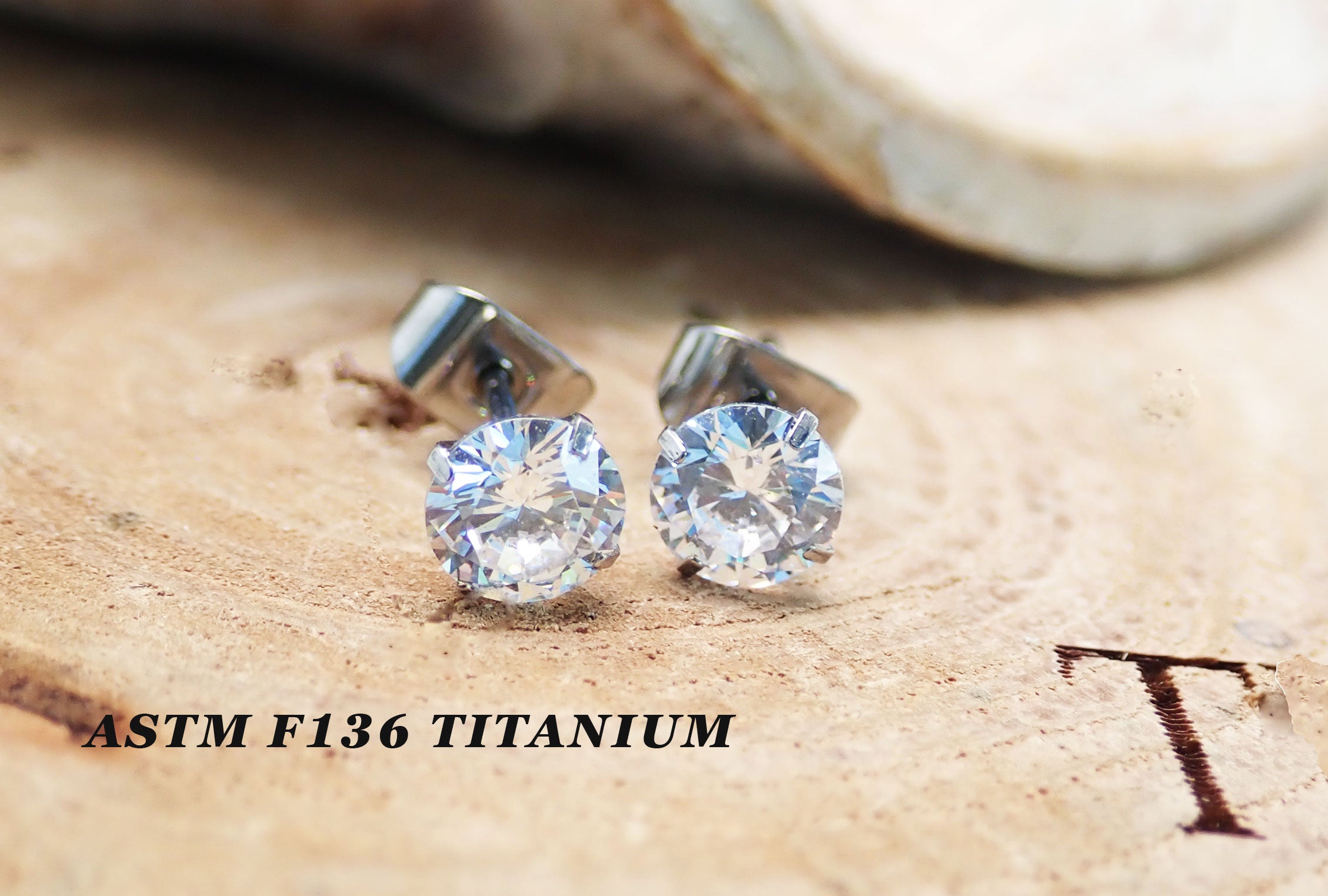Pair of Halobes titanium implant earrings with 4mm cubic zirconia stones, 20g gauge, for pierced ears, durable and stylish jewelry