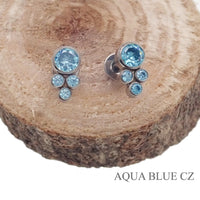 Pair of Halobes blue titanium implant earrings featuring CZ cluster design, 20g gauge, for pierced ears.