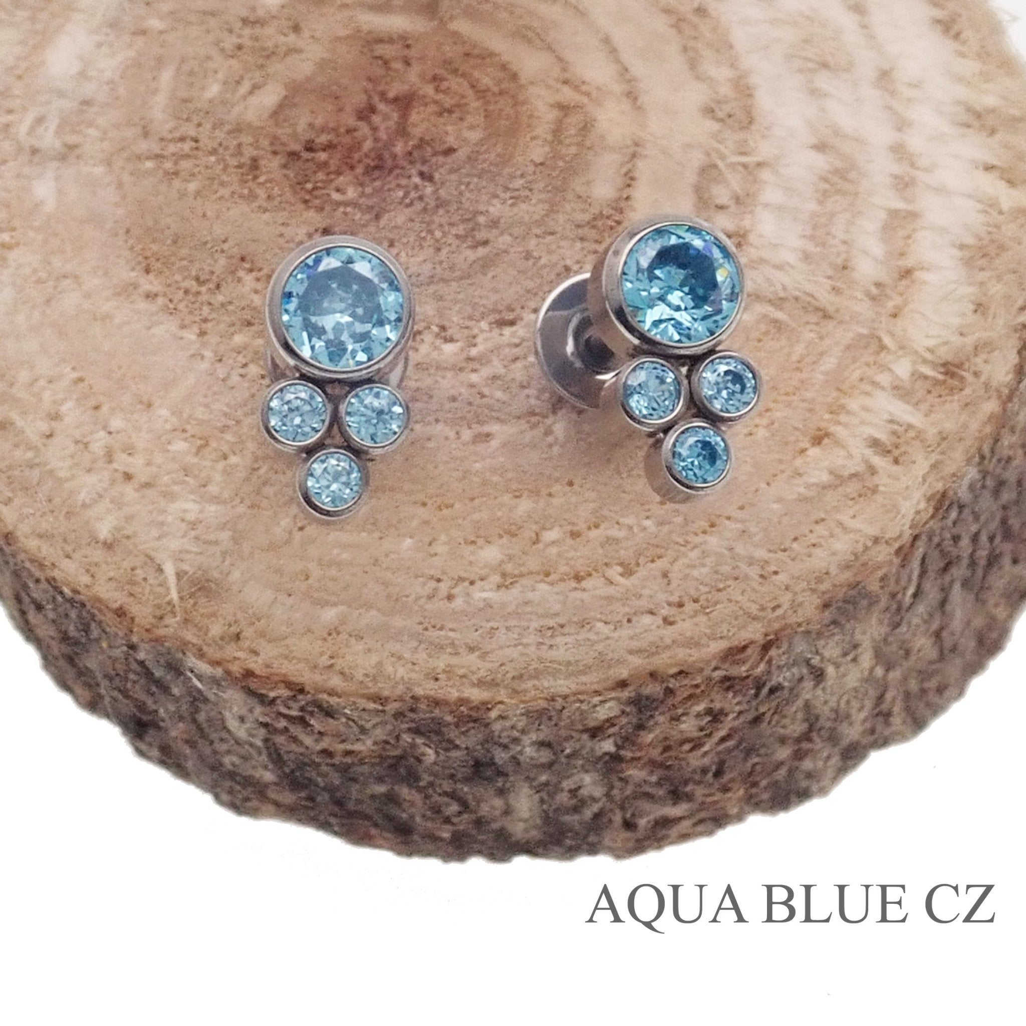 Pair of Halobes blue titanium implant earrings featuring CZ cluster design, 20g gauge, for pierced ears.