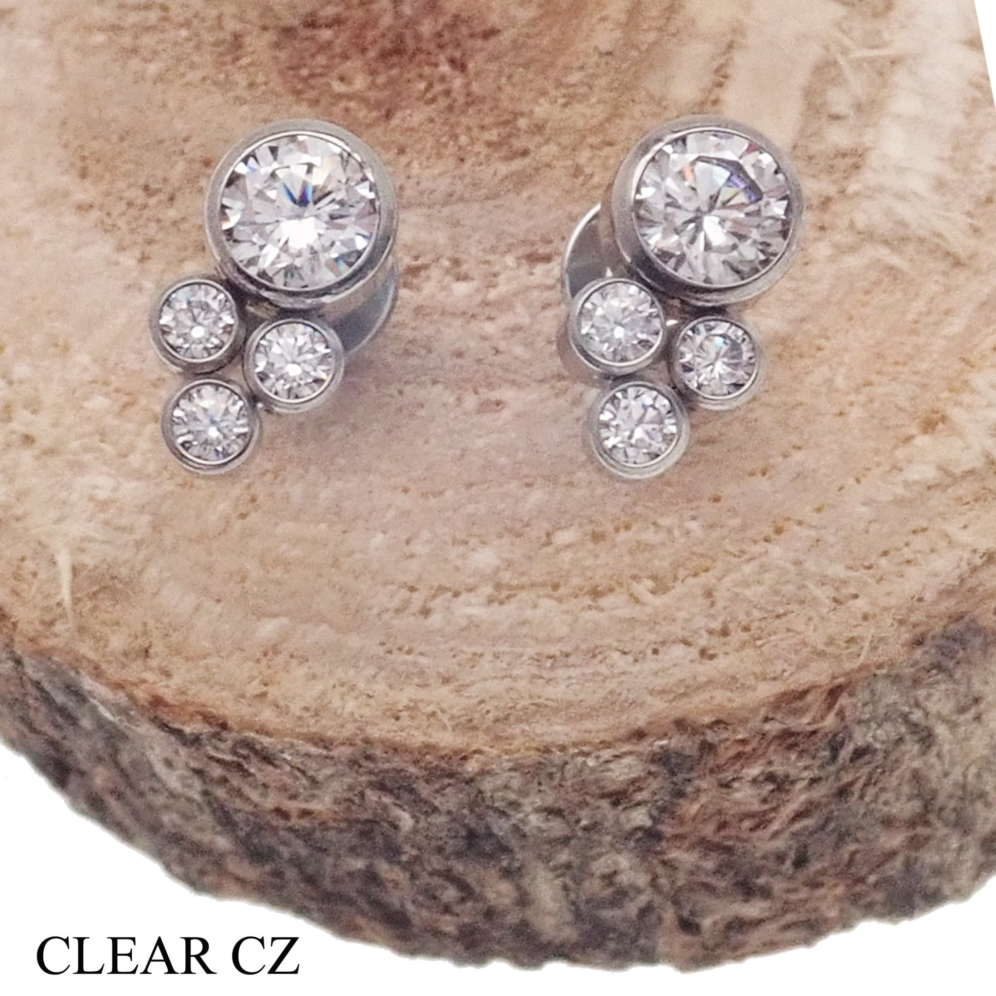 Blue titanium implant earrings with CZ cluster design, 20g pair by Halobes, showcasing a stylish and durable jewelry accessory.