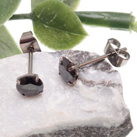 Black CZ implant titanium earrings in 20g size by Halobes, showcasing sleek, modern jewelry design with a secure post.