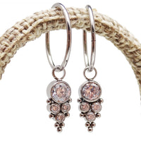 Halobes titanium charm CZ beaded cluster earrings with intricate detailing and sparkling stones.