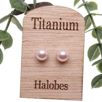 Titanium earrings by HALOBES featuring Swarovski blush pearls and sleek titanium setting for elegant jewelry style.