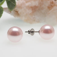 Titanium earrings by HALOBES featuring Swarovski blush pearls and sleek titanium metal for elegant jewelry.