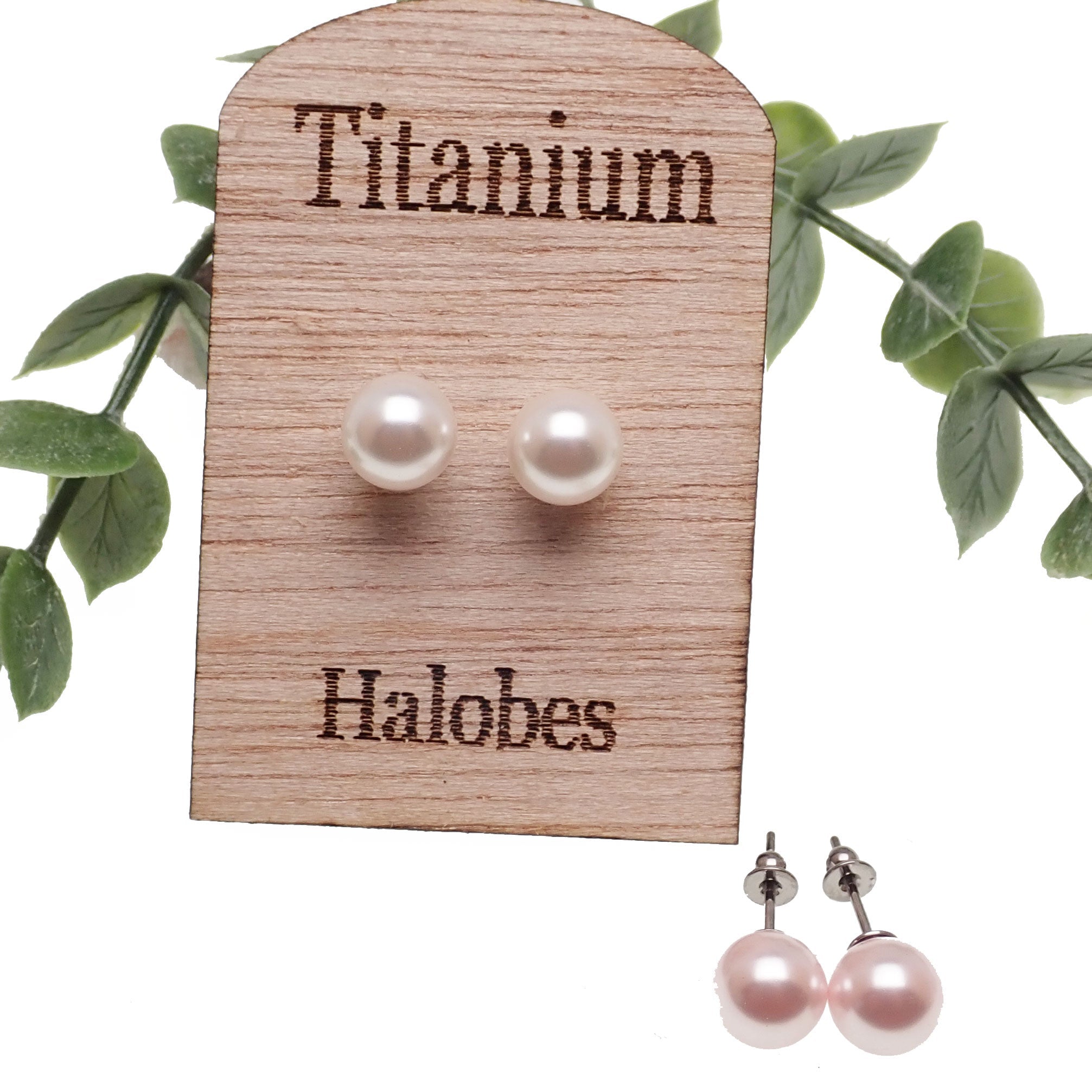 Titanium earrings by HALOBES featuring Swarovski blush pearls and sleek titanium design for elegant jewelry.
