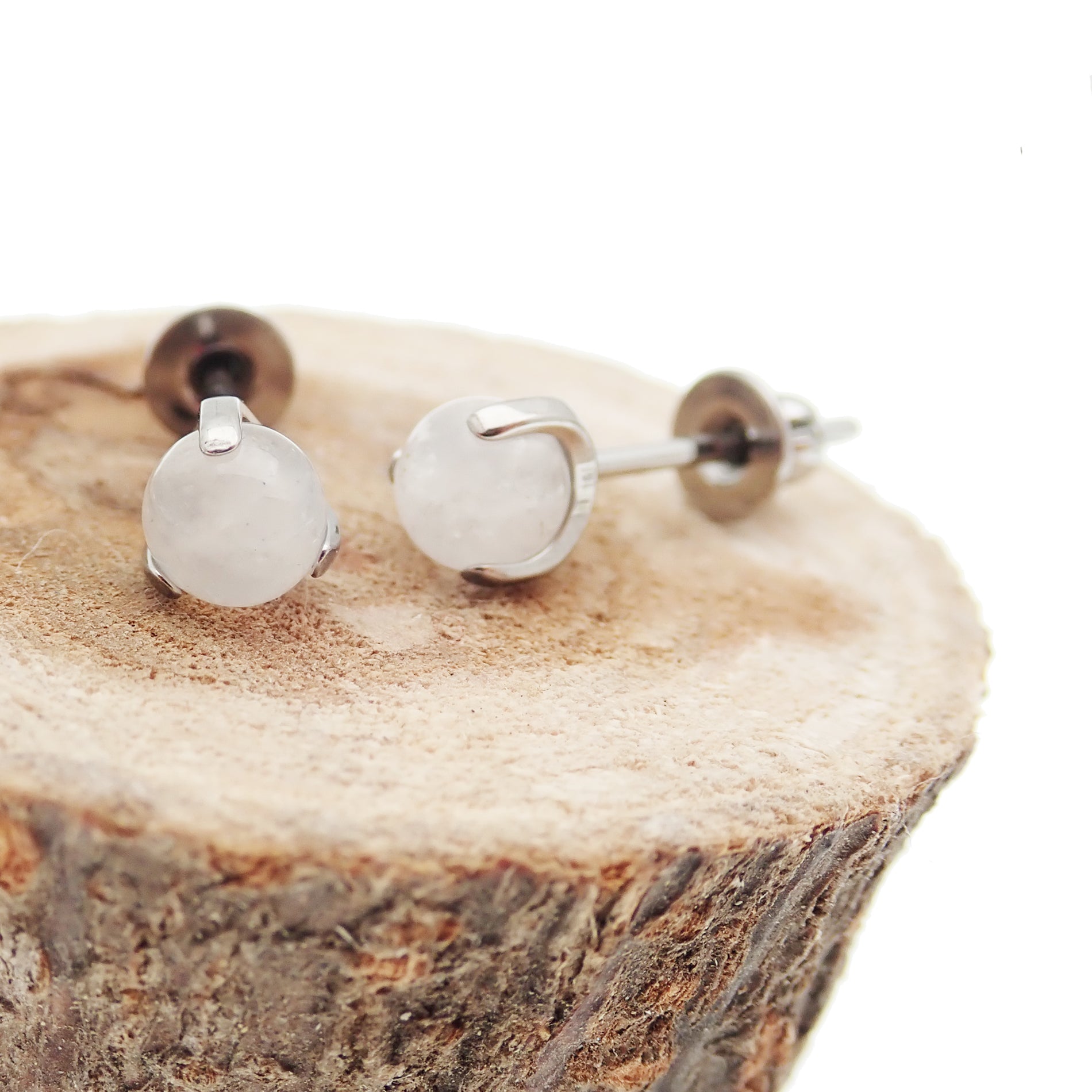 Pair of Halobes titanium stud earrings with natural jade stone implants, 20g lightweight jewelry for pierced ears.