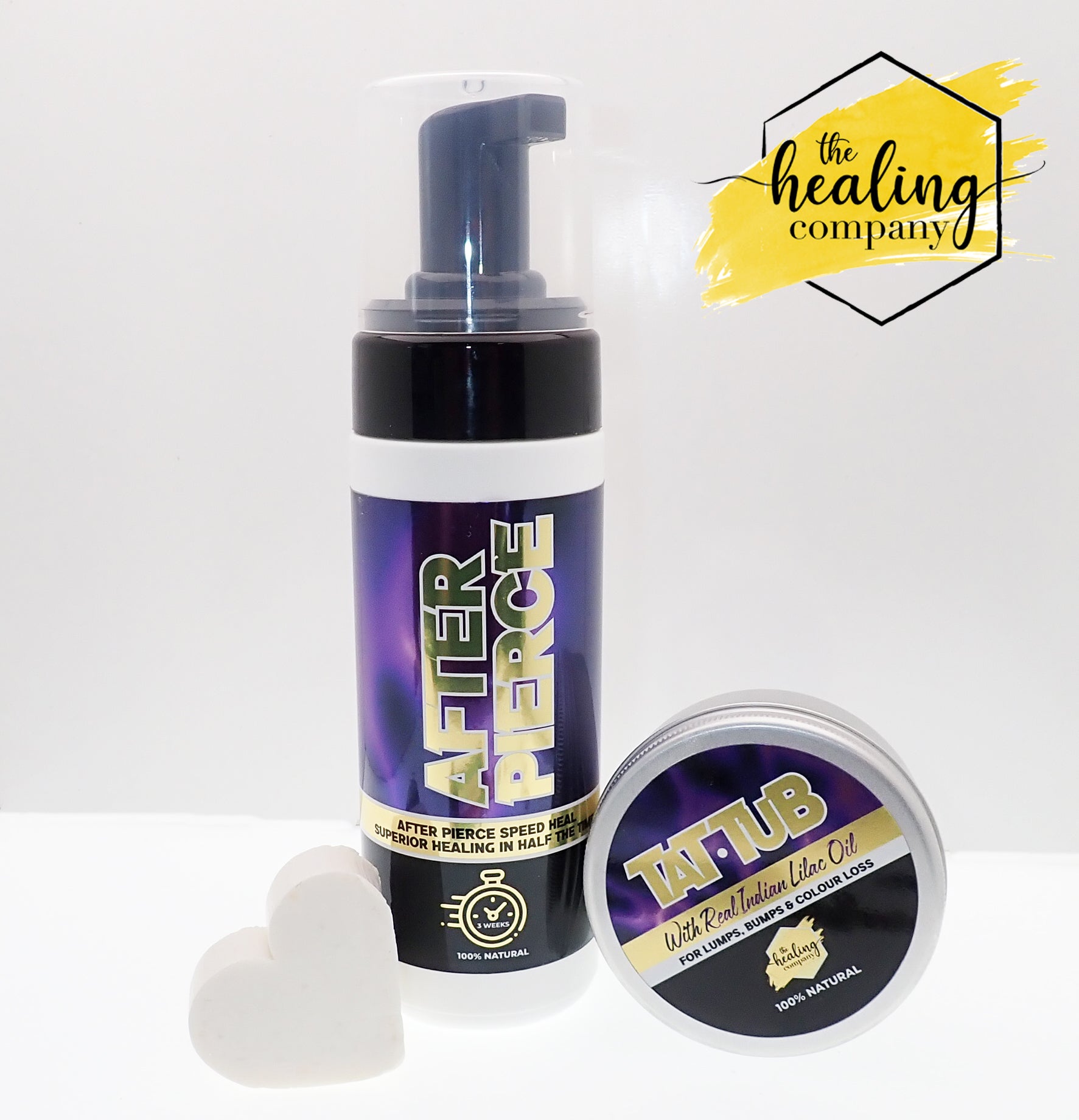 Healing Company piercing soap for fixing lumps and bumps, featuring a clear bottle with label and soap inside.