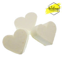 Healing Company piercing soap for healing and reducing lumps and bumps around piercings, shown in a clear bottle with label.