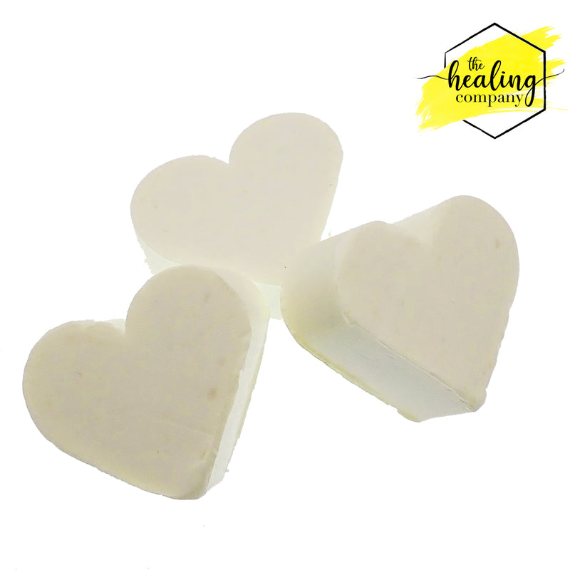 Healing Company piercing soap for healing and reducing lumps and bumps around piercings, shown in a clear bottle with label.