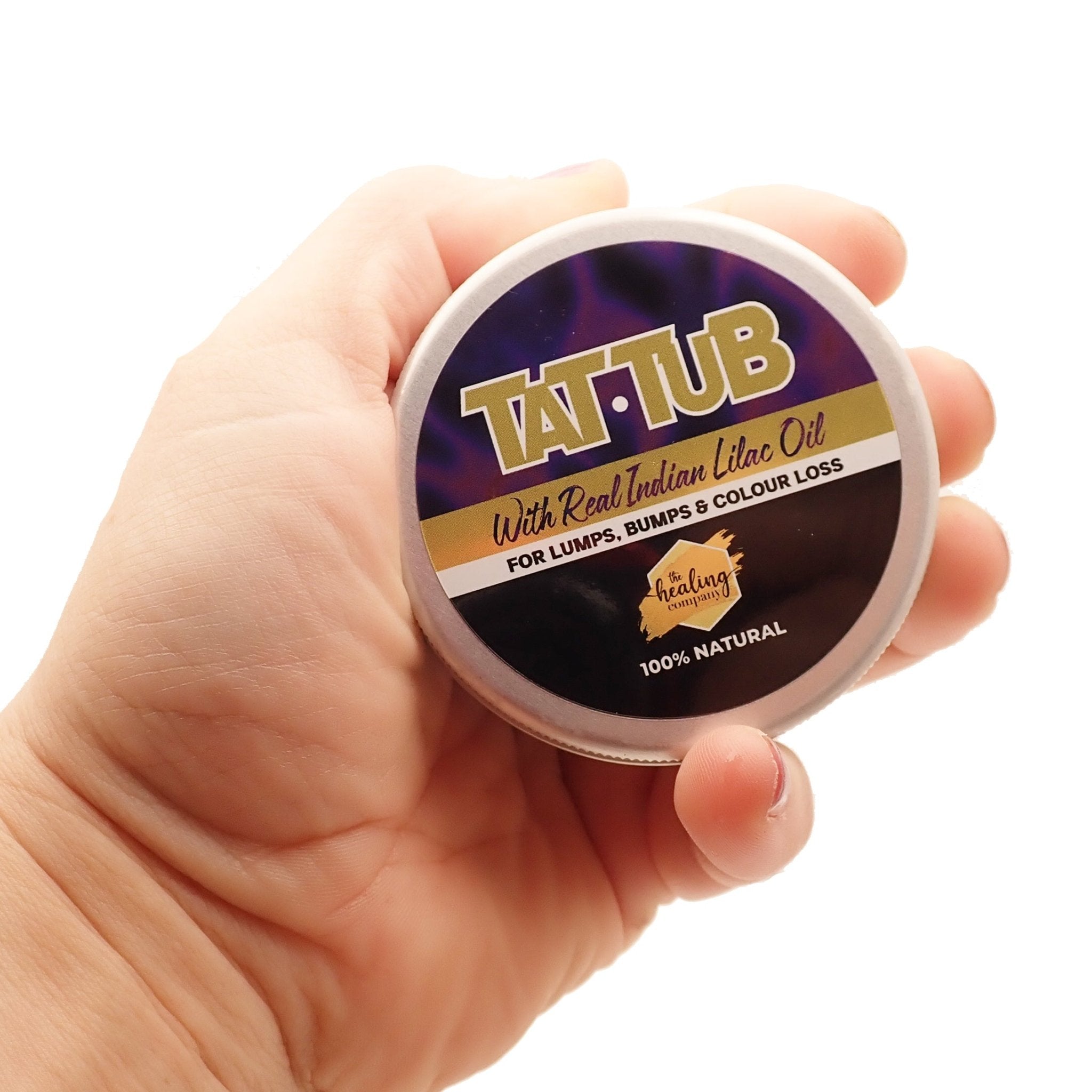 Healing Company Tat Tub Luxury Tattoo Butter 75g in hand, showcasing creamy, moisturizing tattoo healing cream for fresh tattoos.
