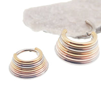 Magpie stacked trio metal titanium clicker earring in 14g or 16g with 8mm width, showcasing layered design and polished finish.