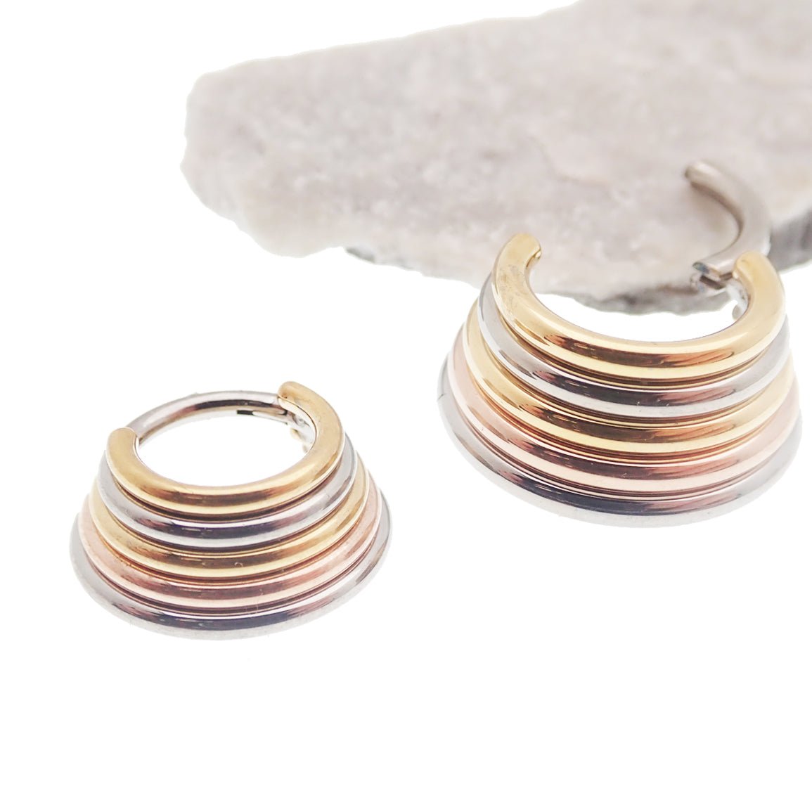 Magpie stacked trio metal titanium clicker earring in 14g or 16g with 8mm width, showcasing layered design and polished finish.