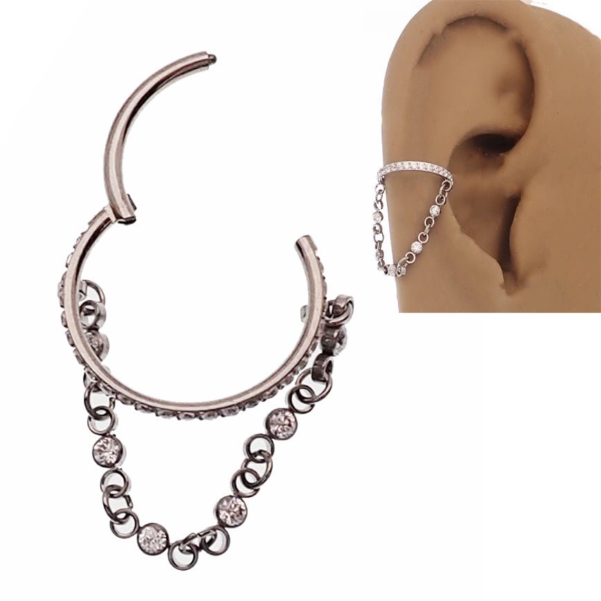 Magpie 16g hinged clicker piercing with dangle chain and cubic zirconia, showcasing the jewelry's elegant design and hinged closure.