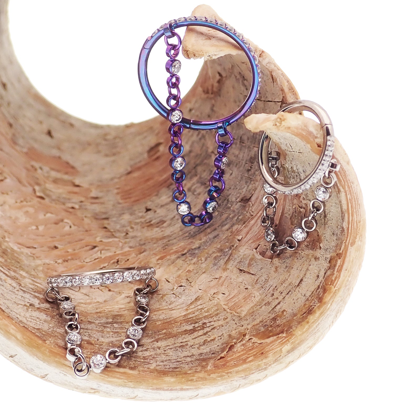 Magpie 16g hinged clicker piercing with dangle chain and CZ stones, showcasing a stylish hinged jewelry design.