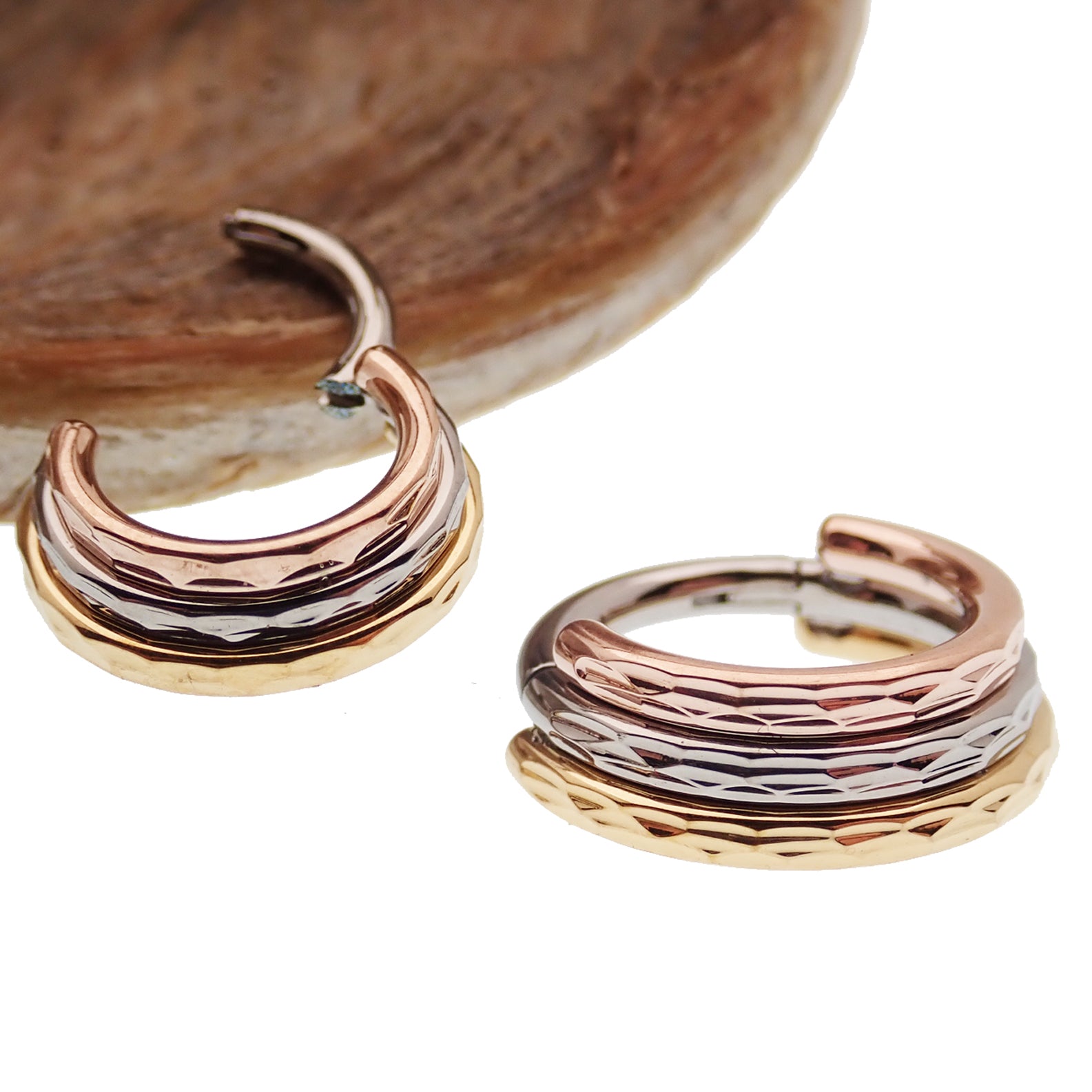 Hammered Trio metal septum clicker by Magpie, stacked design with 16g and 14g gauges, featuring hammered finish and 8mm size.