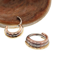 Hammered Trio metal stacked septum clicker by Magpie, 16g and 14g, with hammered finish and stacked design.