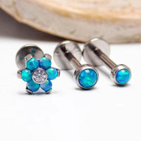 Titanium Peacock Blue Opal Triple Helix Set featuring titanium jewelry with peacock blue opal accents and a triple helix design.
