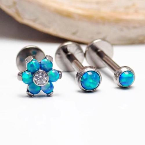 Titanium Peacock Blue Opal Triple Helix Set featuring titanium jewelry with peacock blue opal accents and a triple helix design.