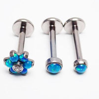 Titanium Peacock Blue Opal Triple Helix Set featuring three interconnected titanium rings with peacock blue opal accents.