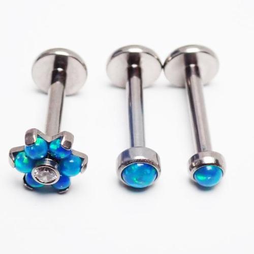 Titanium Peacock Blue Opal Triple Helix Set featuring three interconnected titanium rings with peacock blue opal accents.