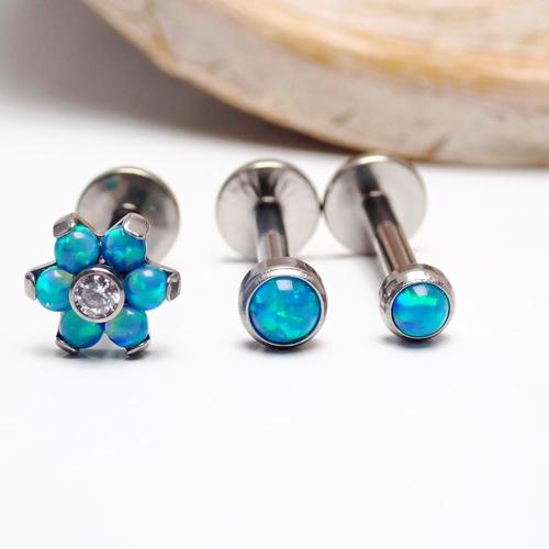 Titanium peacock blue opal triple helix body jewelry set with 18g titanium hoops and opal accents, stylish and vibrant.