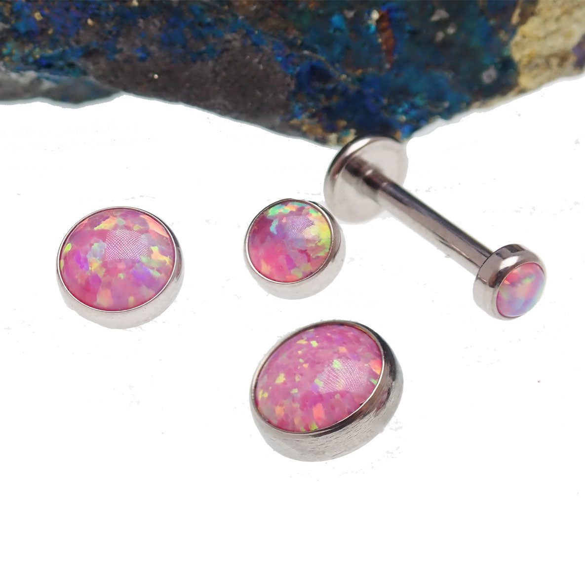 Rose pink opal titanium flatback internally threaded body jewelry with 0.9mm thread and 3mm gauge, 6mm diameter.