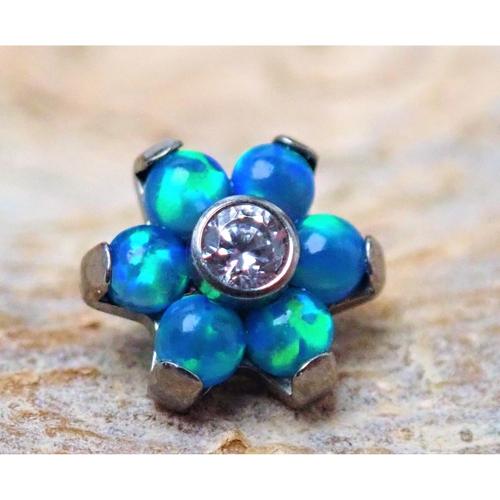 Titanium Peacock Blue Flower Attachment 16g for body jewelry, featuring a detailed blue flower design.
