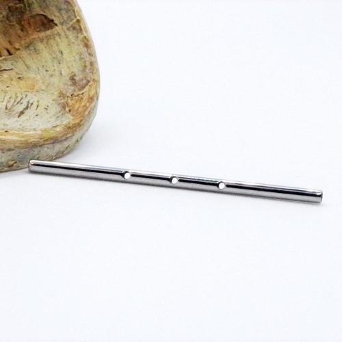 Internally threaded titanium industrial bar with three centered holes, 14g, for body piercing jewelry.