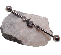 Titanium Deluxe Crystal Stone Moon Industrial Scaffold piercing with 14g industrial bar showing detailed design and polished finish.