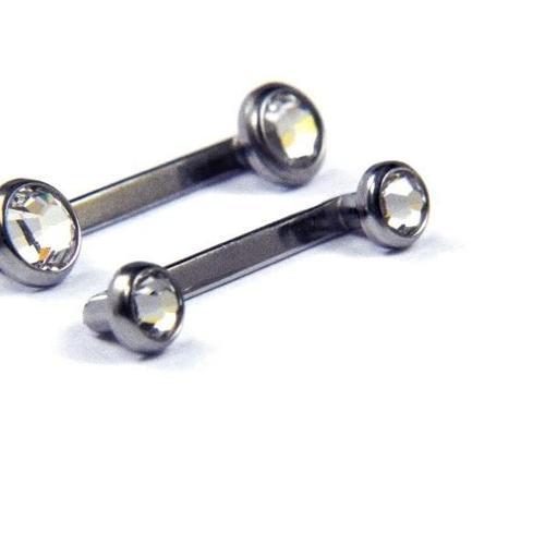 Titanium 14g 5/8 inch Swarovski crystal disc surface barbell with sparkling crystal details on a surface piercing bar.